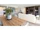 Open floor plan with a view of the kitchen and dining area and a large, wall-mounted entertainment center at 253 Minorca Beach Way # 205, New Smyrna Beach, FL 32169