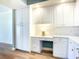 Bright built-in office nook, featuring a stylish backsplash, ample storage, and a dedicated workspace at 253 Minorca Beach Way # 205, New Smyrna Beach, FL 32169
