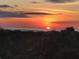 Breathtaking sunset view over the ocean from the property, highlighting the scenic location at 253 Minorca Beach Way # 205, New Smyrna Beach, FL 32169