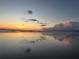Beautiful ocean beach reflecting sunset with colorful clouds at 3325 Pintello Ave, New Smyrna Beach, FL 32168