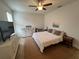 Bedroom with a bed and dresser, featuring natural light and tiled floors, providing a comfortable living space at 3325 Pintello Ave, New Smyrna Beach, FL 32168