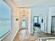 Inviting foyer with decorative wreath, chandelier and plenty of natural light at 3325 Pintello Ave, New Smyrna Beach, FL 32168