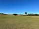 Picturesque golf course showcasing rolling hills, manicured grass, and natural trees at 3325 Pintello Ave, New Smyrna Beach, FL 32168