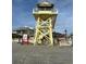 Beachfront property with lifeguard tower and sandy beach at 3325 Pintello Ave, New Smyrna Beach, FL 32168