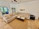 Comfortable living room features a large sectional sofa, neutral tones, and a stylish area rug at 3325 Pintello Ave, New Smyrna Beach, FL 32168