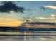 Scenic ocean view at sunset with light rays beaming through the clouds at 3325 Pintello Ave, New Smyrna Beach, FL 32168