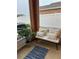 Relaxing screened patio with comfortable seating and a stylish rug at 3325 Pintello Ave, New Smyrna Beach, FL 32168