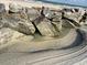 Beach view with a rocky shoreline and a bird standing on a rock at 3325 Pintello Ave, New Smyrna Beach, FL 32168