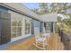 Charming porch featuring rocking chairs, providing a relaxing outdoor space with a view of the yard at 532 Faulkner St, New Smyrna Beach, FL 32168