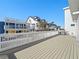 Large deck with ocean views and nearby houses at 6530 S Atlantic Ave, New Smyrna Beach, FL 32169