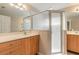 Bathroom with double sinks and a glass shower at 6793 Calistoga Cir, Port Orange, FL 32128