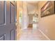 Inviting foyer with tile flooring leading to a spacious living area and an open floor plan at 6793 Calistoga Cir, Port Orange, FL 32128