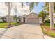 Charming home with a well-manicured lawn and mature trees at 6793 Calistoga Cir, Port Orange, FL 32128