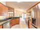 Modern kitchen with granite countertops and stainless steel appliances at 6793 Calistoga Cir, Port Orange, FL 32128
