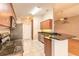 Well-equipped kitchen with stainless steel appliances and dark granite countertops at 6793 Calistoga Cir, Port Orange, FL 32128