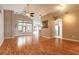 Spacious living room boasting wood floors, high ceilings, and large windows for ample natural light at 6793 Calistoga Cir, Port Orange, FL 32128