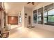 Bright sunroom with tile floors, natural light, and access to the outdoors and backyard at 6793 Calistoga Cir, Port Orange, FL 32128