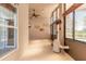 Bright sunroom with tile floors, ceiling fan, large windows, and views of the backyard pool at 6793 Calistoga Cir, Port Orange, FL 32128
