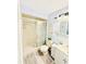 Cozy bathroom with a tiled shower, vanity, and charming decor for a relaxing experience at 824 Garfish Ave, New Smyrna Beach, FL 32169