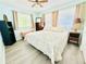 Inviting bedroom with neutral tones, large windows, and cozy decor for a relaxing retreat at 824 Garfish Ave, New Smyrna Beach, FL 32169