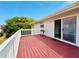 Spacious deck featuring white railings and open access from the slider doors, offering outdoor relaxation at 824 Garfish Ave, New Smyrna Beach, FL 32169