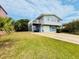 Charming two-story home with a large front yard and a private balcony overlooking the street at 824 Garfish Ave, New Smyrna Beach, FL 32169