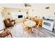 Cozy living room featuring a dining table, comfortable seating, and well-lit atmosphere with a nice view at 824 Garfish Ave, New Smyrna Beach, FL 32169