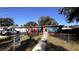 Quaint single-story home with fenced yard and turquoise accents at 131 W Palm Way, Edgewater, FL 32132
