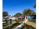 Cute bungalow home with turquoise accents and fenced yard at 131 W Palm Way, Edgewater, FL 32132