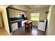 Updated kitchen features modern cabinetry, stainless steel appliances, and wood-look flooring at 131 W Palm Way, Edgewater, FL 32132
