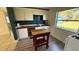 Renovated kitchen with butcher block island at 131 W Palm Way, Edgewater, FL 32132