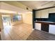 Remodeled kitchen with white cabinets and wood countertop at 131 W Palm Way, Edgewater, FL 32132