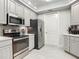 Modern kitchen with stainless steel appliances and light gray cabinets at 2 Riverwalk Dr # 302, New Smyrna Beach, FL 32169