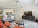 Spacious living area featuring a comfortable sofa and a view into the kitchen at 2 Riverwalk Dr # 302, New Smyrna Beach, FL 32169