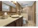 Bathroom with a stone vanity, vessel sink, large mirror, and walk-in shower at 4621 S Atlantic Ave # 7101, Ponce Inlet, FL 32127