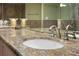 Close-up of granite countertop and faucet in bathroom at 4621 S Atlantic Ave # 7101, Ponce Inlet, FL 32127