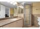 Bathroom featuring granite vanity and glass shower enclosure at 4621 S Atlantic Ave # 7101, Ponce Inlet, FL 32127