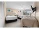 Comfortable bedroom with two beds, surf themed art, and plantation shutters at 4621 S Atlantic Ave # 7101, Ponce Inlet, FL 32127