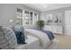Tastefully decorated bedroom with nautical art and plantation shutters at 4621 S Atlantic Ave # 7101, Ponce Inlet, FL 32127