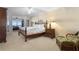 Bedroom features french doors leading to an ocean view, a ceiling fan, and wicker chair at 4621 S Atlantic Ave # 7101, Ponce Inlet, FL 32127