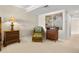 Bedroom features wicker furnishings, neutral walls, and decorative artwork at 4621 S Atlantic Ave # 7101, Ponce Inlet, FL 32127