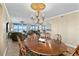 Open concept dining room with chandelier and ocean views, perfect for entertaining at 4621 S Atlantic Ave # 7101, Ponce Inlet, FL 32127