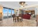 Open-concept dining area adjacent to ocean view balcony and living space at 4621 S Atlantic Ave # 7101, Ponce Inlet, FL 32127