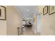 Hallway with decorative touches, leading to the dining area and living spaces at 4621 S Atlantic Ave # 7101, Ponce Inlet, FL 32127