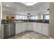 Granite countertops and stainless appliances highlight this contemporary kitchen design at 4621 S Atlantic Ave # 7101, Ponce Inlet, FL 32127