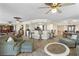 Spacious living room featuring a wet bar, comfortable seating, and neutral tones at 4621 S Atlantic Ave # 7101, Ponce Inlet, FL 32127