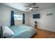 Bedroom with wood floors, ceiling fan, and window coverings at 4623 Saxon Dr, New Smyrna Beach, FL 32169