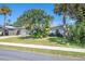 House exterior showcasing landscaping and driveway at 4623 Saxon Dr, New Smyrna Beach, FL 32169