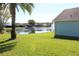 Lush backyard with view of the pond and water feature offering serene outdoor living at 537 Coral Trace Blvd, Edgewater, FL 32132