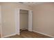 Bedroom with a closet that has bifold doors and laminate flooring at 537 Coral Trace Blvd, Edgewater, FL 32132